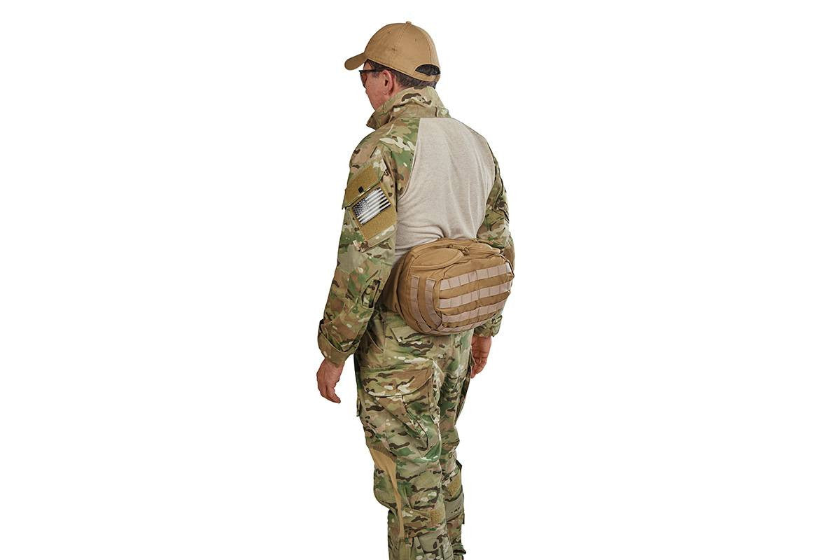 Soldier wearing lid from Kelty Falcon 4000 USA backpack on his waist, fanny-pack style